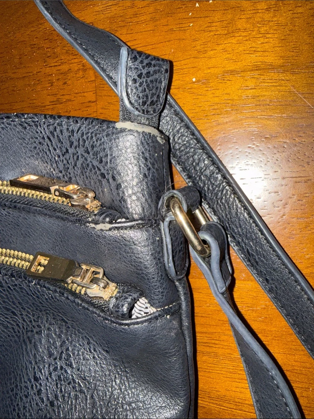 Classic Black Leather Crossbody Bag with Gold Zippers